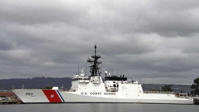 shutterstock_229880047 A U.S. Coast Guard ship docked under cloudy skies