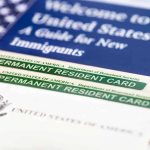 ICE Detains Soldier’s Wife—Outrage Erupts A guide for new immigrants alongside permanent resident cards and an American flag