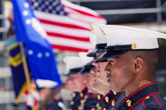 shutterstock_355868381-1- Marines in uniform standing in formation with flags in the background
