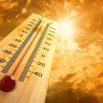 Endless Summer Alert: 2026’s Heatwave Shocker A thermometer displaying temperature against a sunset sky