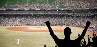 Foul Ball Horror: Fan Rushed to ER! Crowd of fans cheering at a baseball game in a stadium