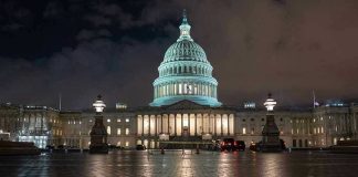 Trump Threatens D.C. Takeover NEXT WEEK – What’s TRIGGERING This? U.S. Capitol building illuminated at night with wet pavement.