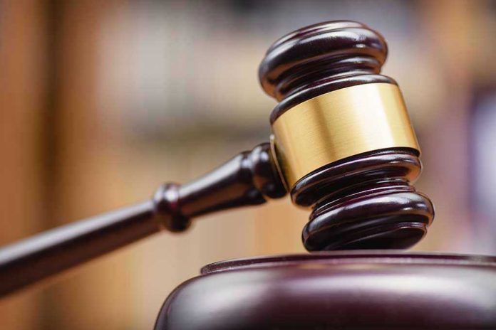 Judges gavel striking a sound block.