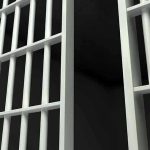 Governor’s Shock Move Frees Convicted Firebrand Close-up of prison cell bars.
