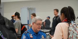 TSA Uncovers LIVE Bomb — UNEXPECTED TWIST TSA agent checks passengers documents at airport security.