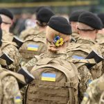 WITCHES Of Bucha — What THEY DO Soldiers in camouflage uniforms with Ukrainian flags.