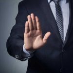 SCOTUS BOMBSHELL — Judge THOMAS Issues CHILLING WARNING Man in suit with hand raised, signaling stop.