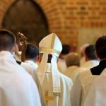 CHILLING Hit Job? Bishop Killed in OWN HOME Clerics in white robes facing altar in church