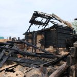 ANCIENT Town Torched — JUSTICE SILENT Burned wooden house with collapsed, charred beams and roof remains