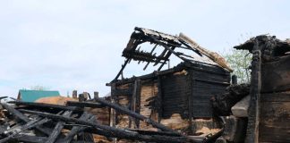 ANCIENT Town Torched — JUSTICE SILENT Burned wooden house with collapsed, charred beams and roof remains