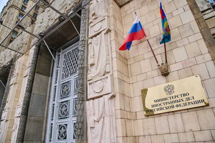 ministry-of-foreign-affairs-of-russia-building2312303563jpg Russian ministry building entrance with ornate metal door and flags