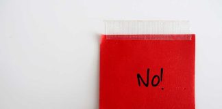 DESPICABLE — BIDEN JUDGE Kneecaps Trump A red sticky note with the word 'No!' written in black ink