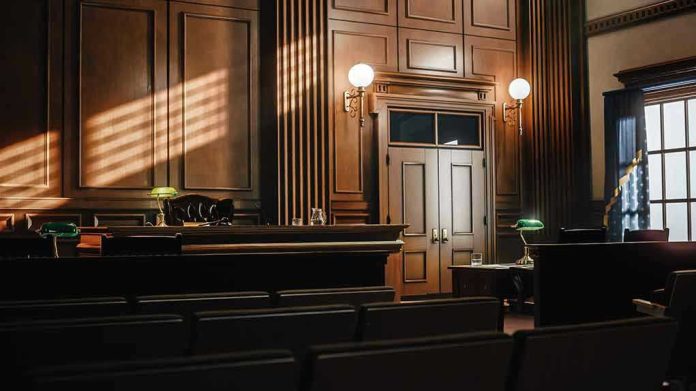 2056420763-1 Empty courtroom with judges bench and wooden decor.