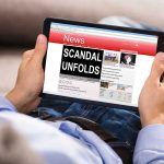 MASSIVE SCANDAL — Royalties Vanish Into UNION PRESIDENT’S Black Box Person reading tablet with headline Scandal Unfolds.