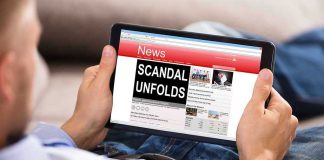 MASSIVE SCANDAL — Royalties Vanish Into UNION PRESIDENT’S Black Box Person reading tablet with headline Scandal Unfolds.