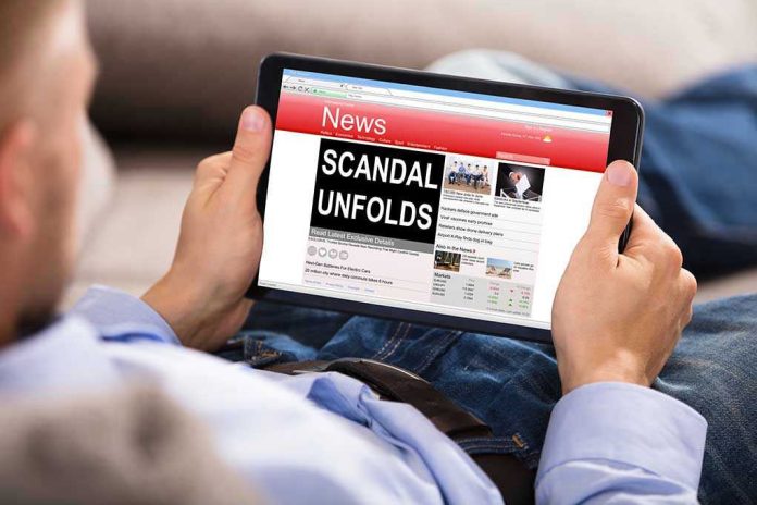 686343781-1 Person reading tablet with headline Scandal Unfolds.