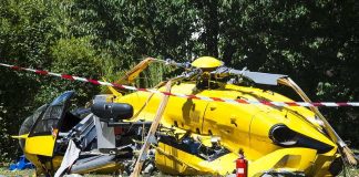 Thrill Flights Under Fire After Shocking Smash yellow helicopter crash scene on grassy field