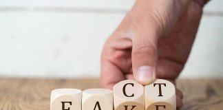 Six-Foot Rule EXPOSED As Make-Believe! Hand flipping wooden blocks on a table