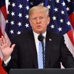 TRUMP is PUSHING the Senate to STOP THIS NOW man speaking at podium with American flags behind