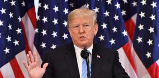TRUMP is PUSHING the Senate to STOP THIS NOW man speaking at podium with American flags behind