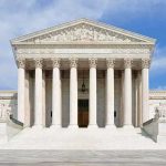 NEW Birthright Bombshell — Congress DEFIES Supreme Court! Front view of the Supreme Court building with large columns and steps under a blue sky
