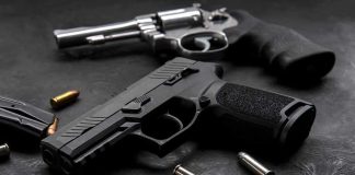 TRIPLE EXECUTION Over $65 DISPUTE! Handgun and revolver with scattered bullets on dark surface