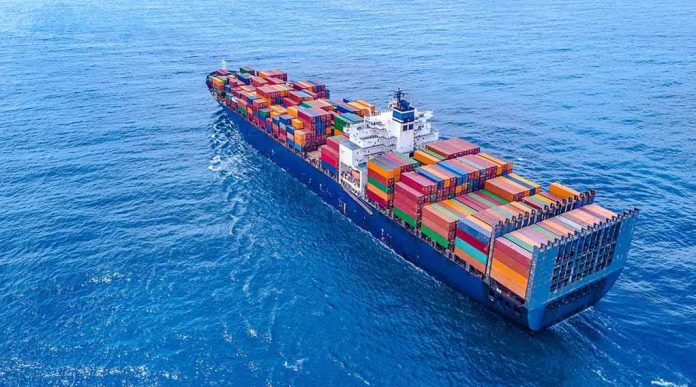 shutterstock_1457257346 Container ship carrying colorful cargo containers at sea