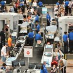 TRUMP Blocks Americans From RETURNING HOME! Busy airport security checkpoint with travelers and TSA agents