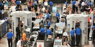 TRUMP Blocks Americans From RETURNING HOME! Busy airport security checkpoint with travelers and TSA agents