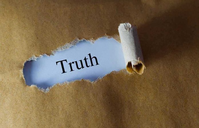 Torn brown paper revealing the word 'Truth' on white background
