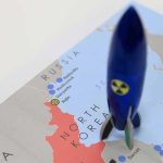 33-Minute NIGHTMARE — No WAY to STOP IT! Blue toy rocket on a map of North Korea and surrounding countries