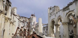 TRAGIC — Arson TORCHES 140-Year CATHOLIC Icon Interior view of a destroyed building with collapsed arches and debris