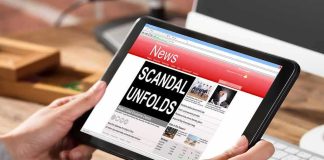 Missing Kids SCANDAL Engulfs Former HHS TOP BOSS Hands holding a tablet showing an online news website
