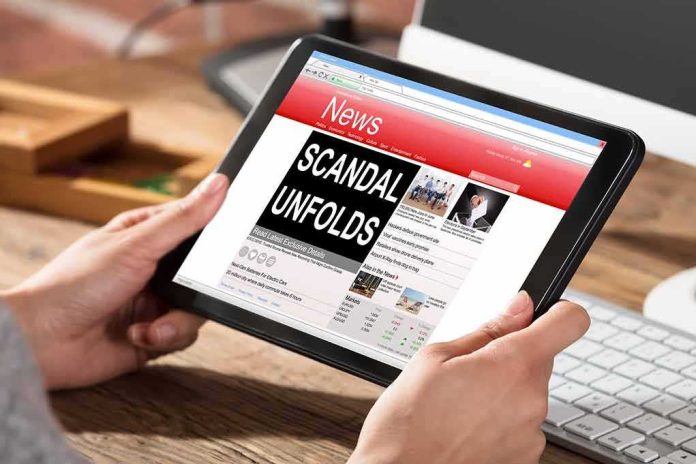 shutterstock_625950956 Hands holding a tablet showing an online news website