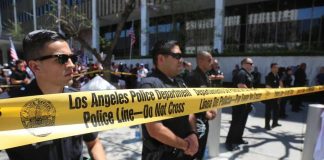 HORRIFYING Child Ring JUST EXPOSED Los Angeles police officers standing behind a police line