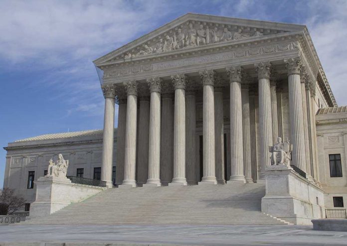 shutterstock_Eletric-car United States Supreme Court building with grand columns and steps