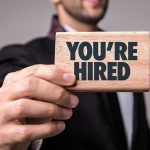 Look WHO Trump Just Hired as New LEGAL HAMMER Person holding a Youre Hired sign.