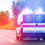 Bus Horror STUNS Florida Ambulance van with flashing lights on a rural road