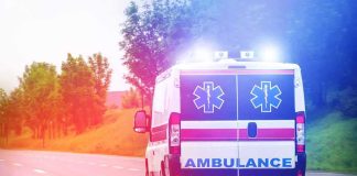 Bus Horror STUNS Florida Ambulance van with flashing lights on a rural road