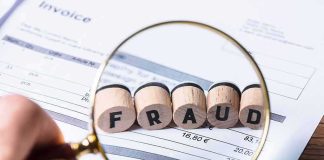 BRAND NEW Medicaid Scam Ring EXPOSED! Magnifying glass highlighting wooden blocks spelling fraud on an invoice