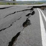 SPORTS ICON Dethroned — 20-Year Wall Cracks Asphalt road with deep cracks and collapse