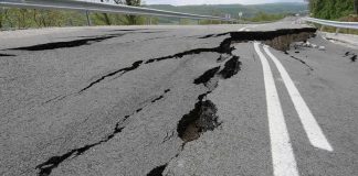 SPORTS ICON Dethroned — 20-Year Wall Cracks Asphalt road with deep cracks and collapse