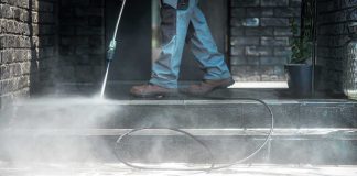 OUTRAGEOUS — ICONIC Memorial TRASHED Worker pressure washing outdoor steps