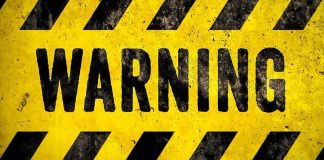 Khamenei’s NEW Warning Jolts Gulf warning sign with yellow and black hazard stripes