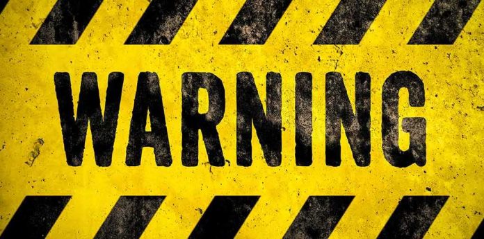 shutterstock_1196537179 warning sign with yellow and black hazard stripes