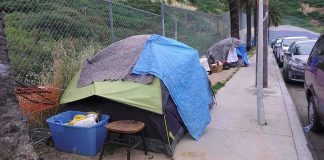 RESIDENTS Hire Ex-Gang Patrols to CLEAN UP Homelessness — WHAT?? Tent encampment along a city sidewalk