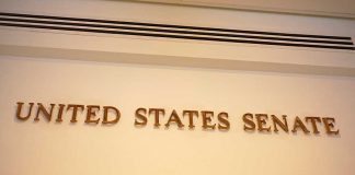 Senator EXPOSES ‘Danger’ Inside Congress Sign displaying United States Senate in a government building