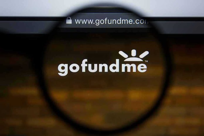 shutterstock_1460614706 gofundme logo under magnifying glass