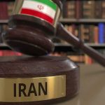 Iran’s Chilling RETRIBUTION LAW Strikes HARD Judge's gavel with Iran label in law library
