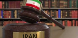 Iran’s Chilling RETRIBUTION LAW Strikes HARD Judge's gavel with Iran label in law library